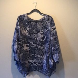 Blue, shark hem, full coverage shirt.